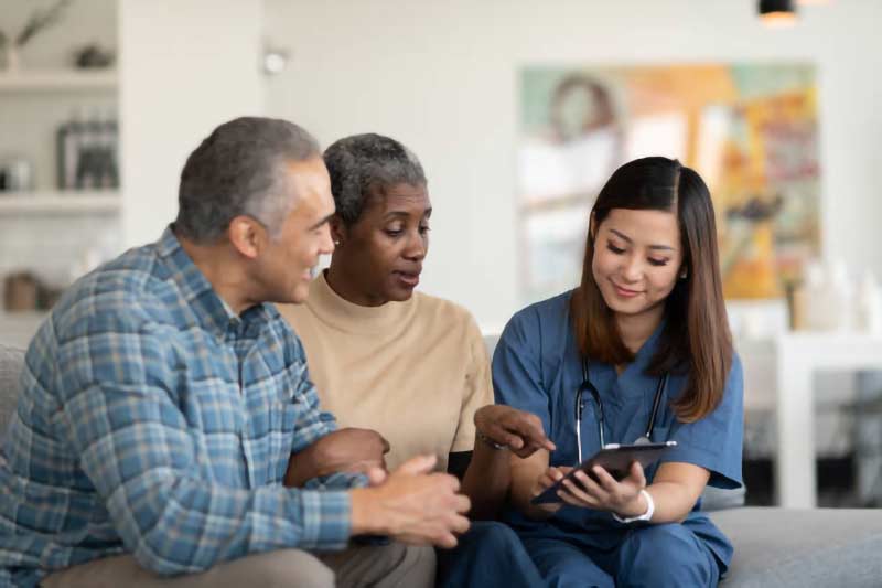 Female healthcare professional consulting a couple